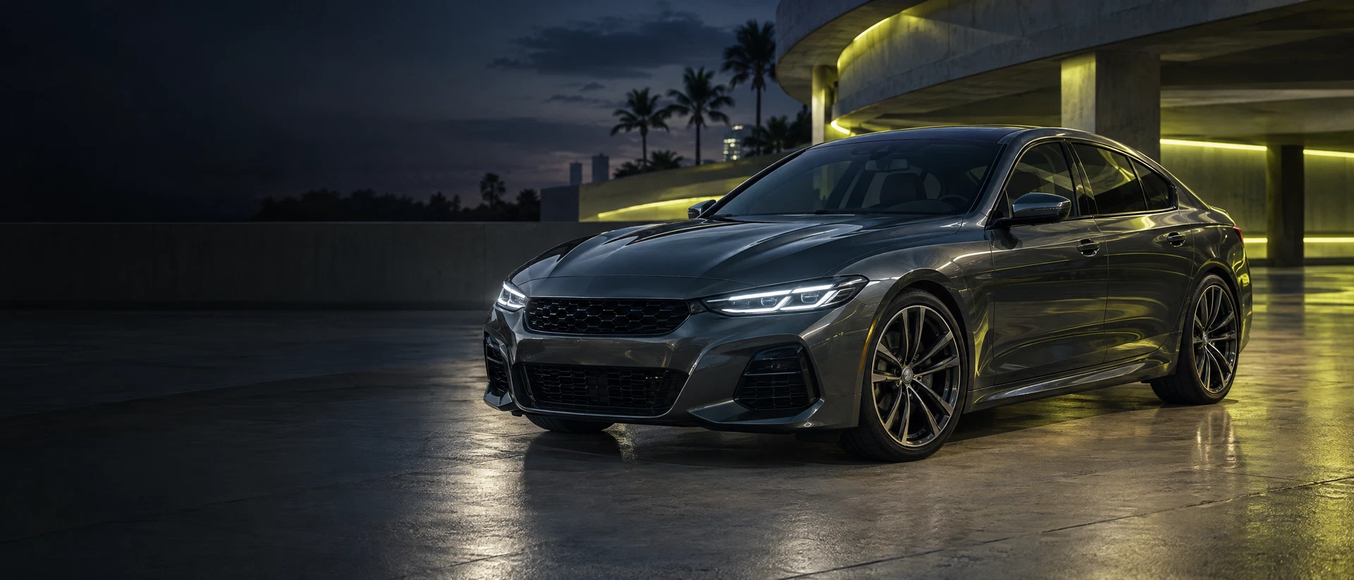 Illustrative graphite sedan photographed at dusk